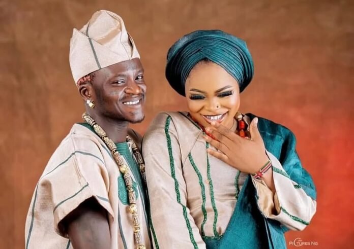 Portable Welcomes Son With Wife Bewaji After Boxing Match Defeat